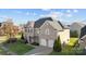 Charming brick home with manicured landscaping, driveway, and an attached two-car garage at 15138 Callow Forest Dr, Charlotte, NC 28273