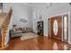 Grand foyer featuring hardwood floors, a staircase, and a stunning front door at 15138 Callow Forest Dr, Charlotte, NC 28273