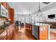 Spacious kitchen features cherry cabinets, granite countertops, stainless steel appliances, and a large island at 15138 Callow Forest Dr, Charlotte, NC 28273