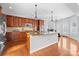 Modern kitchen with an island, granite countertops, and stainless steel appliances at 15138 Callow Forest Dr, Charlotte, NC 28273