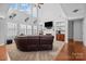Inviting living room featuring a fireplace, built-in shelves, and large windows at 15138 Callow Forest Dr, Charlotte, NC 28273