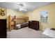 Spacious bedroom featuring a bunk bed, window, ceiling fan, and neutral-toned carpet flooring at 1514 Ring Tail Rd, Claremont, NC 28610