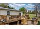 Wooden deck features multiple stairs, seating, and outdoor space at 1514 Ring Tail Rd, Claremont, NC 28610