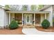 A welcoming front porch with stone accents, pillars, and a 'Welcome' sign at 1514 Ring Tail Rd, Claremont, NC 28610
