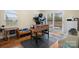 Bright game room with foosball table, treadmill, walk-out, and natural light at 1514 Ring Tail Rd, Claremont, NC 28610