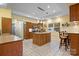 Bright kitchen featuring wooden cabinets, tile floors, and a center island at 1514 Ring Tail Rd, Claremont, NC 28610
