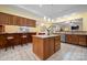 Open kitchen featuring custom wood cabinets, a breakfast bar, and a center island with a countertop at 1514 Ring Tail Rd, Claremont, NC 28610