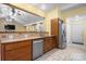 Modern kitchen featuring stainless steel appliances, and an adjacent breakfast nook and entry to front door at 1514 Ring Tail Rd, Claremont, NC 28610