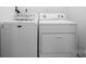 Bright laundry room equipped with a matching washer and dryer at 1514 Ring Tail Rd, Claremont, NC 28610