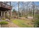 Large backyard with storage shed surrounded by mature trees at 15920 Fieldstone Dr, Matthews, NC 28104