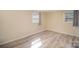 This bedroom offers natural light through two windows and flooring at 15920 Fieldstone Dr, Matthews, NC 28104