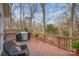 Enjoy grilling on this deck, overlooking a lush treed backyard at 15920 Fieldstone Dr, Matthews, NC 28104