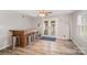 Bright dining area features wood floors, a built-in bar, and access to the outdoor space at 15920 Fieldstone Dr, Matthews, NC 28104