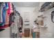 Organized walk-in closet with metal shelving, hanging clothes and shoe racks at 15920 Fieldstone Dr, Matthews, NC 28104