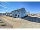 A spacious backyard has a brick patio with wicker furniture and a gray vinyl-sided house at 1766 Loggerhead Dr, Lancaster, SC 29720