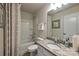 Neutral bathroom with granite countertop vanity, framed mirror, and tub with shower at 1766 Loggerhead Dr, Lancaster, SC 29720