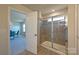 Bathroom featuring tile flooring, a glass shower, and an open doorway to another room at 1766 Loggerhead Dr, Lancaster, SC 29720