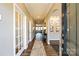 Inviting home entryway featuring a wood floor, interior doors with glass, and an open concept design at 1766 Loggerhead Dr, Lancaster, SC 29720