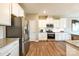 Stylish kitchen featuring stainless steel appliances, granite countertops, and wood flooring at 1766 Loggerhead Dr, Lancaster, SC 29720