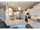 Beautiful kitchen featuring a large center island with seating, granite countertops and stainless appliances at 1766 Loggerhead Dr, Lancaster, SC 29720