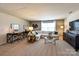 Spacious upstairs loft with comfortable seating, study area, neutral carpet, and natural light at 1766 Loggerhead Dr, Lancaster, SC 29720