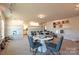 A spacious room has carpet, track lighting, sample walls, and tables with modern office chairs at 1766 Loggerhead Dr, Lancaster, SC 29720