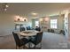 A spacious room has carpet, track lighting, sample walls, and tables with modern office chairs at 1766 Loggerhead Dr, Lancaster, SC 29720