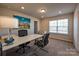 A bright office features carpet, large windows, recessed lights, and a modern desk set at 1766 Loggerhead Dr, Lancaster, SC 29720