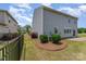 Spacious fenced side yard with manicured landscaping and a well-maintained lawn at 1766 Loggerhead Dr, Lancaster, SC 29720