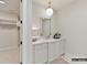 Bathroom featuring a white vanity with mirror, stylish light fixture, and modern decor at 2013 Garden View Ln, Weddington, NC 28104