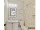 Bathroom showcasing a marble-tiled shower, modern vanity, and sleek finishes at 2013 Garden View Ln, Weddington, NC 28104