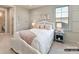 Charming bedroom with soothing color scheme, stylish furnishings, and natural light at 2013 Garden View Ln, Weddington, NC 28104