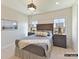 Inviting bedroom features neutral tones, comfortable bedding, and natural light from two windows at 2013 Garden View Ln, Weddington, NC 28104