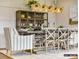 Elegant dining room featuring stylish lighting, decor, and ample seating for memorable gatherings at 2013 Garden View Ln, Weddington, NC 28104