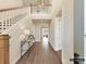 Bright foyer with hardwood floors, soaring ceilings, grand staircase and modern chandelier at 2013 Garden View Ln, Weddington, NC 28104