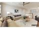 Bright living room features a ceiling fan and a comfortable seating arrangement at 2013 Garden View Ln, Weddington, NC 28104