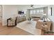 Comfortable living room features hardwood floors, neutral color palette, and lots of natural light at 2013 Garden View Ln, Weddington, NC 28104