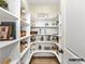 Well-organized pantry features custom shelving and maximizes storage space for a tidy and efficient kitchen at 2013 Garden View Ln, Weddington, NC 28104