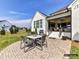Back patio features outdoor dining, a grill, and a covered porch with comfortable seating at 2013 Garden View Ln, Weddington, NC 28104