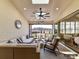 Inviting outdoor patio features comfortable seating, a ceiling fan, and picturesque views of the landscape at 2013 Garden View Ln, Weddington, NC 28104