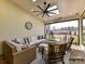 Relaxing outdoor patio with comfortable seating, ceiling fan, and scenic views for enjoying nature at 2013 Garden View Ln, Weddington, NC 28104