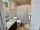 Cozy bathroom with a shower-tub combo, and modern vanity with granite countertop at 218 Cottonwood Park Dr, Charlotte, NC 28214