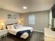 Bedroom with queen-size bed, wood floors, and bright natural light from the window at 218 Cottonwood Park Dr, Charlotte, NC 28214