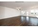 Bright, open living room with hardwood flooring, windows, and an adjacent kitchen at 2315 Riggs Rd, Sherrills Ford, NC 28673
