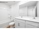 Bathroom with double sink vanity with white countertop, white cabinets and tub with shower at 2319 Riggs Rd, Sherrills Ford, NC 28673