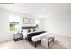 Bright bedroom showcasing large windows, neutral decor, and stylish furnishings, creating a serene living space at 2319 Riggs Rd, Sherrills Ford, NC 28673