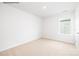 Bedroom featuring neutral carpet, window, and white walls at 2319 Riggs Rd, Sherrills Ford, NC 28673