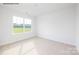 Bright bedroom with a large window and neutral carpet at 2319 Riggs Rd, Sherrills Ford, NC 28673