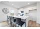 Bright kitchen featuring an island with seating, stainless steel appliances, and white cabinets at 2319 Riggs Rd, Sherrills Ford, NC 28673