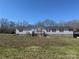 Charming single-story home with gray siding and a red shutters at 25387 Frick Rd, Richfield, NC 28137